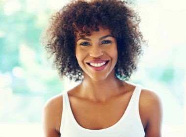 Happy curly natural hair woman