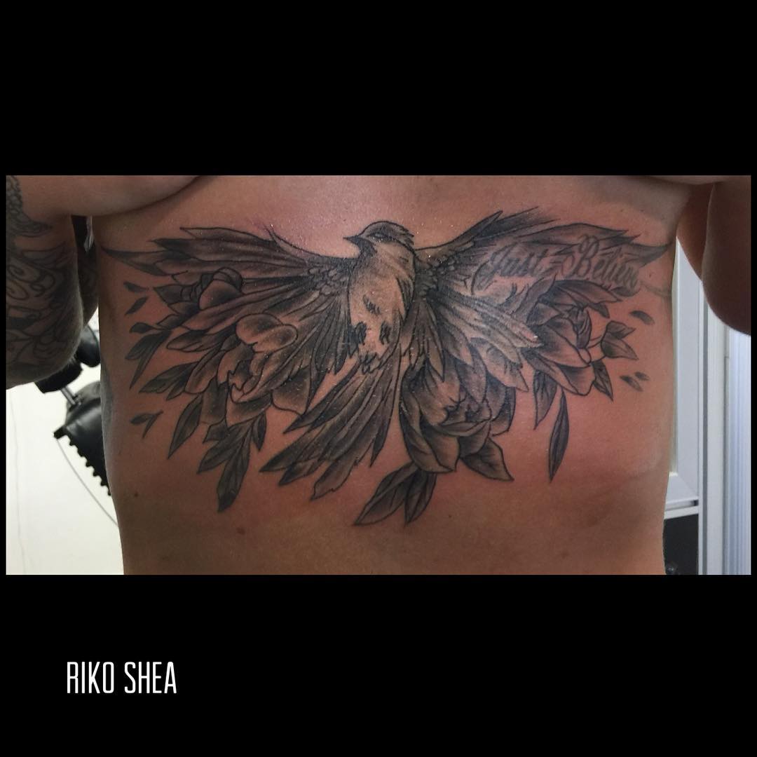 Dramatic underboob tattoo design
