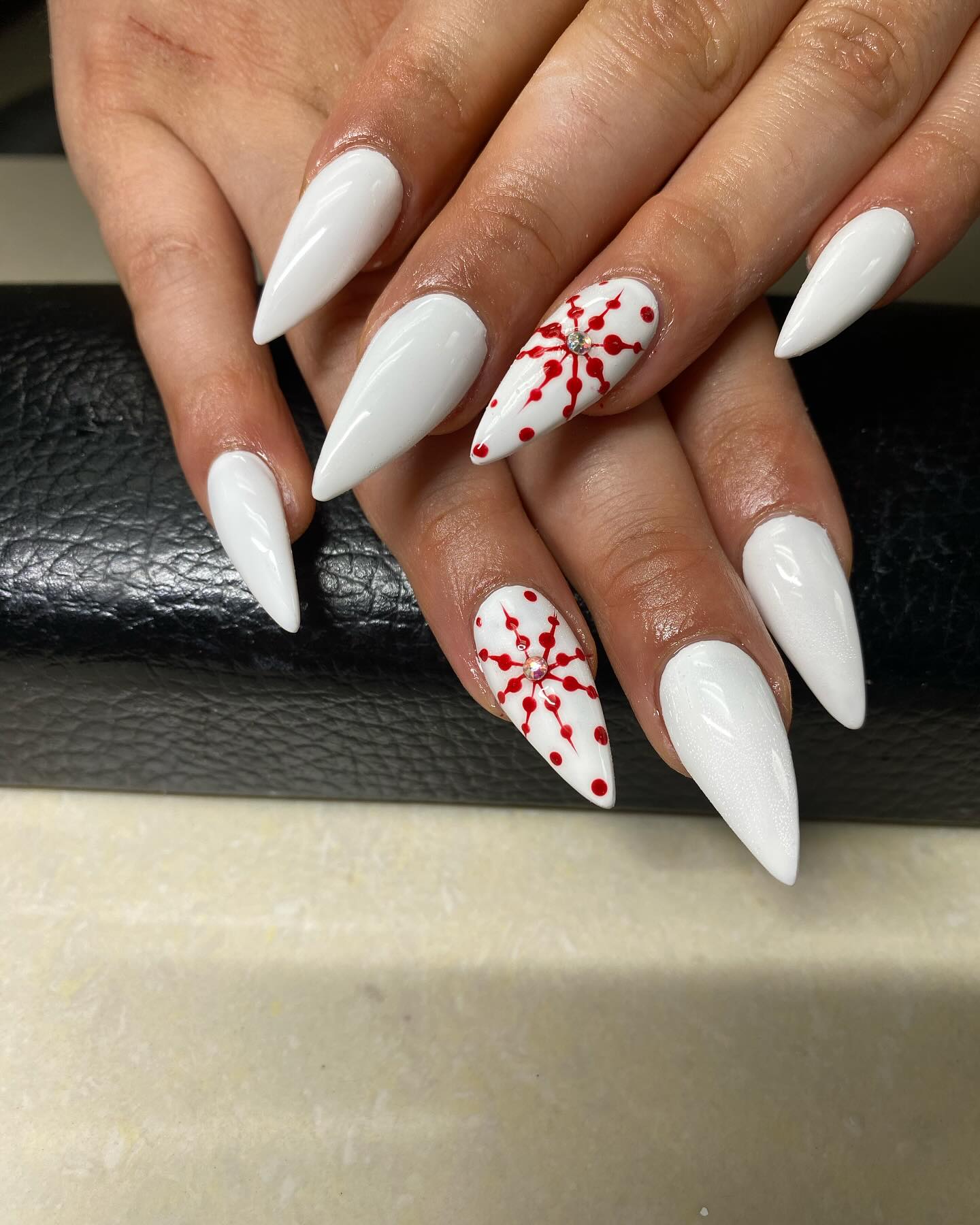 Plain White Pointy Nails With Red Pattern Design