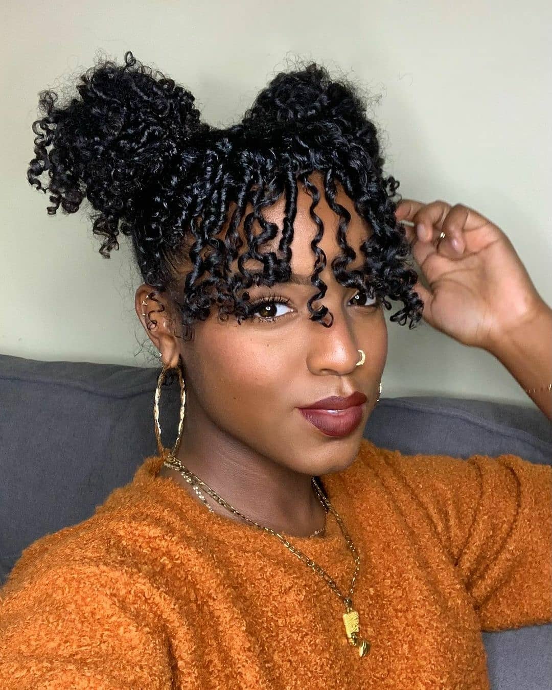Double Bun with Coil Bangs