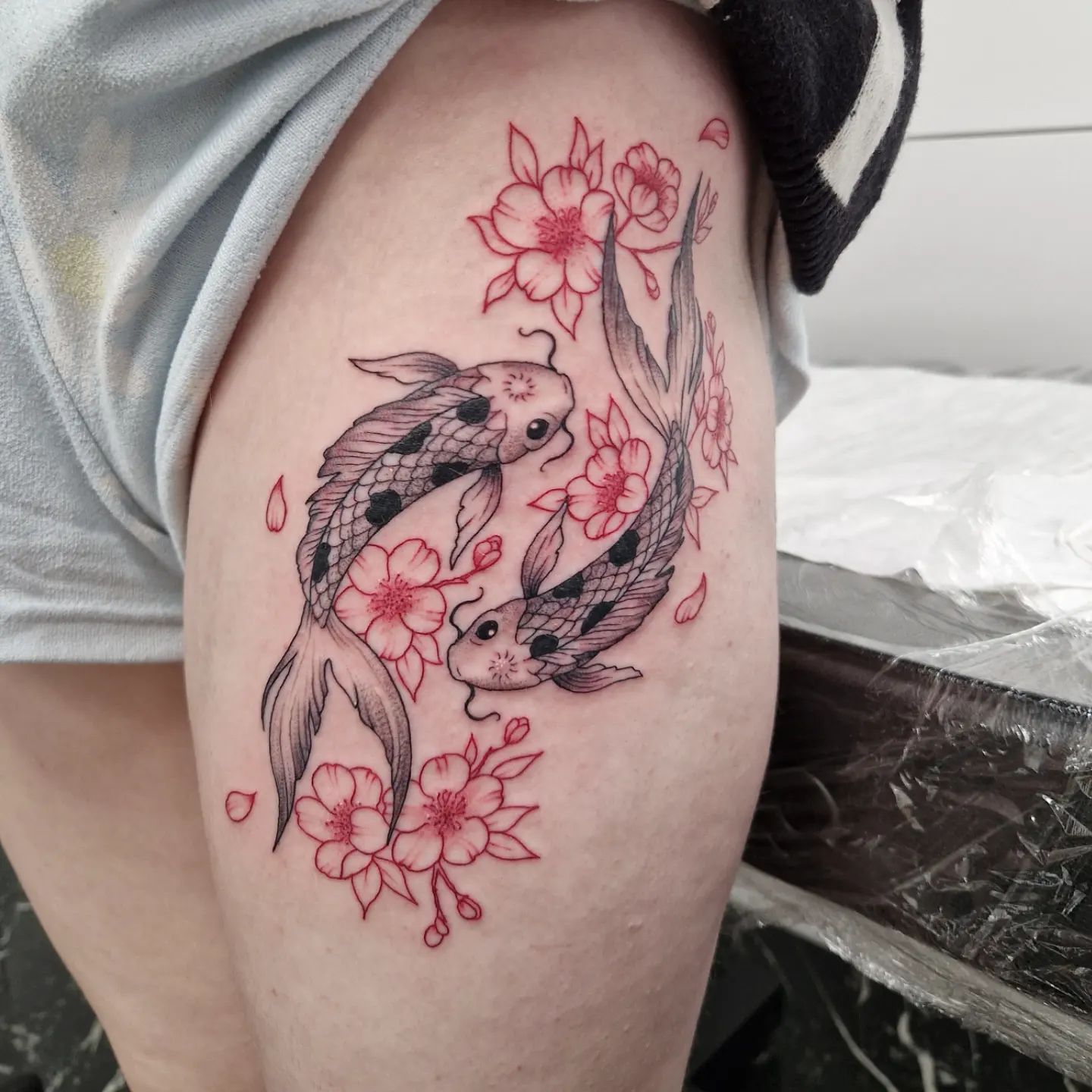 Red Ink KOI Fish Hip Tattoo