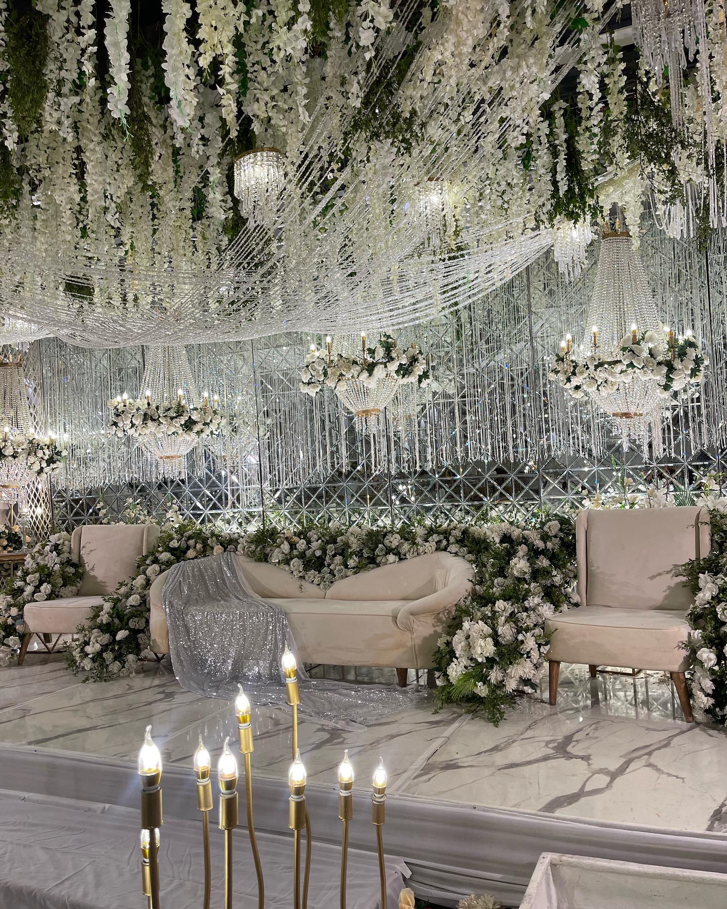 Crystal chandeliers hung from trees