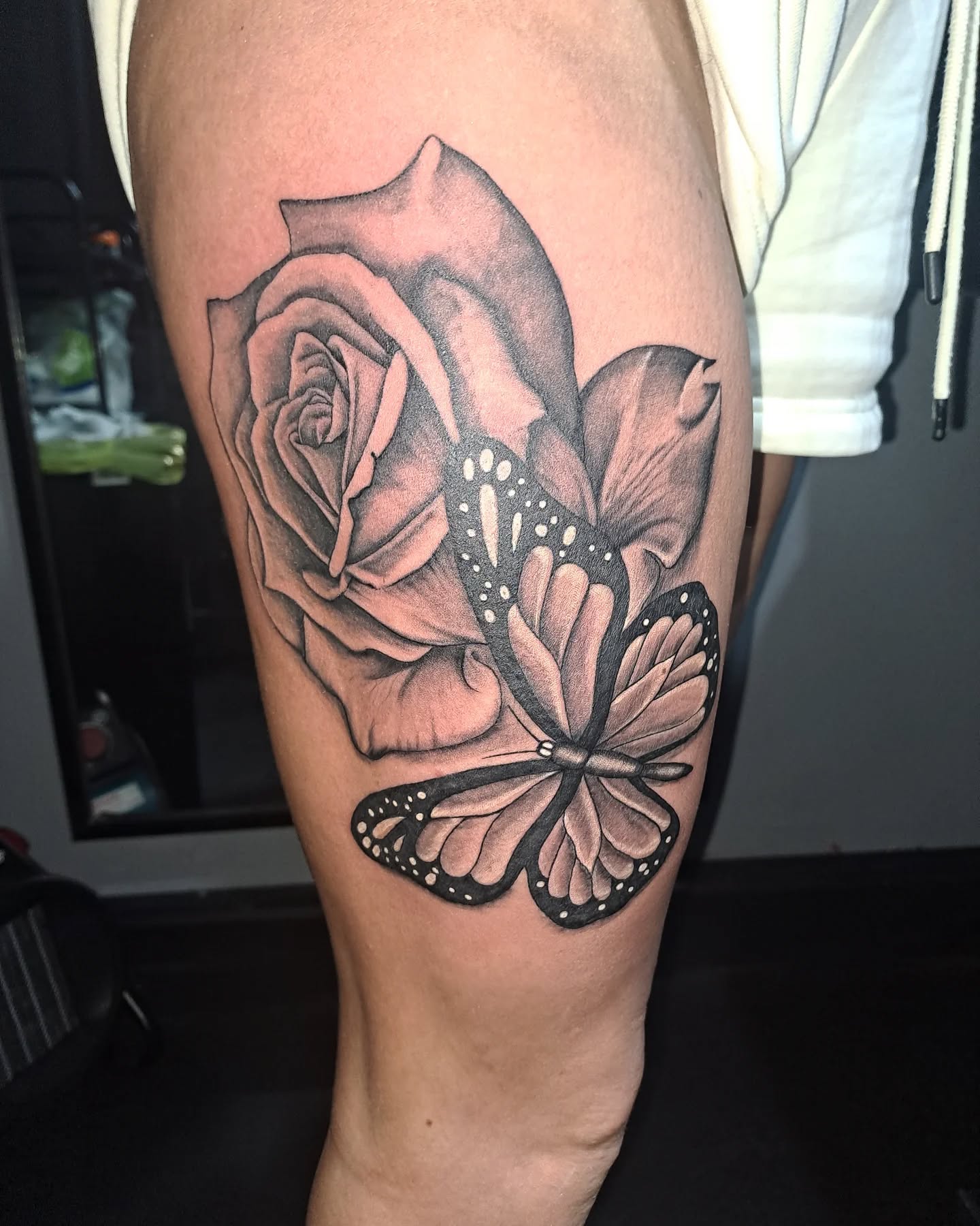 Black And Grey Thigh Tattoo