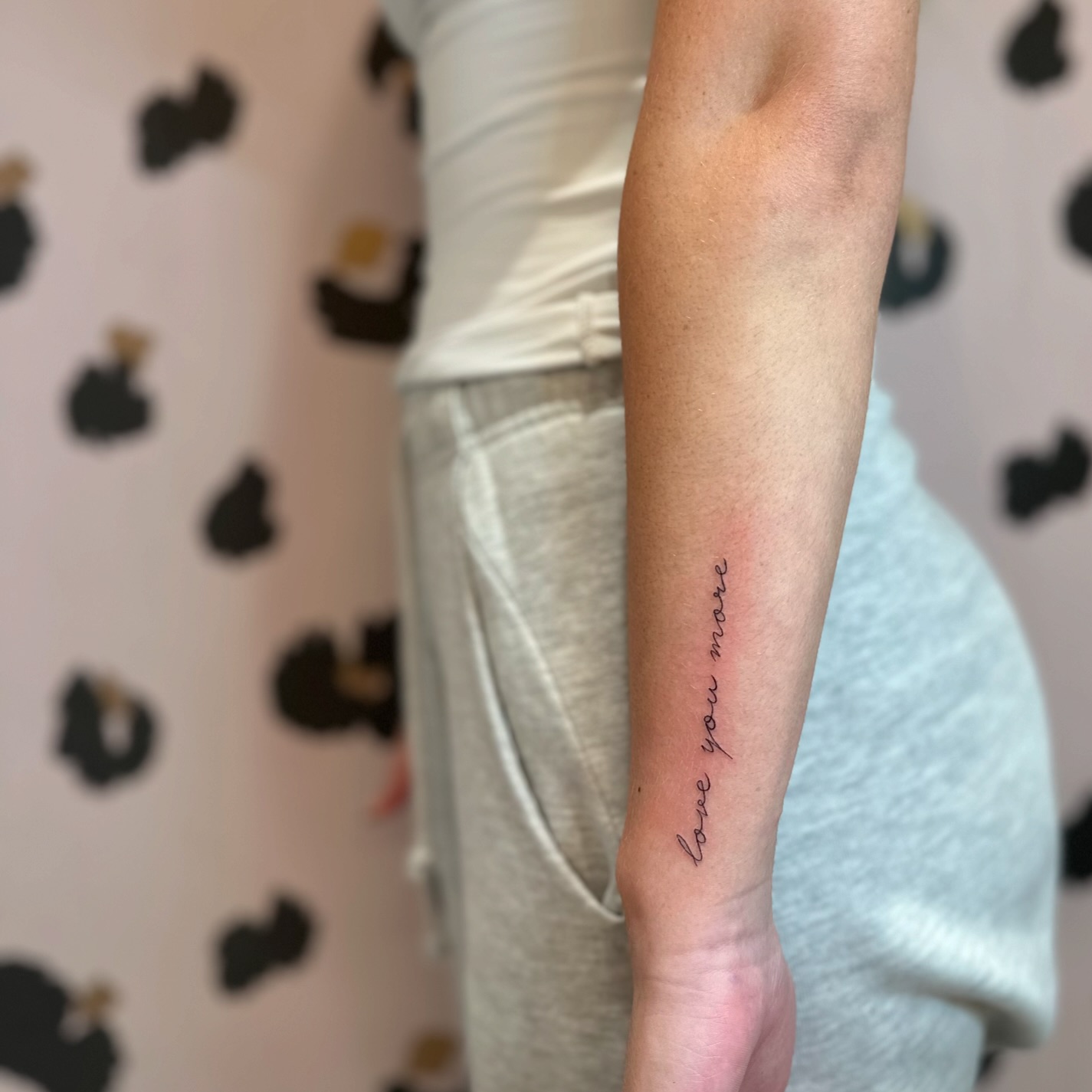 Love You More Wrist Tattoo