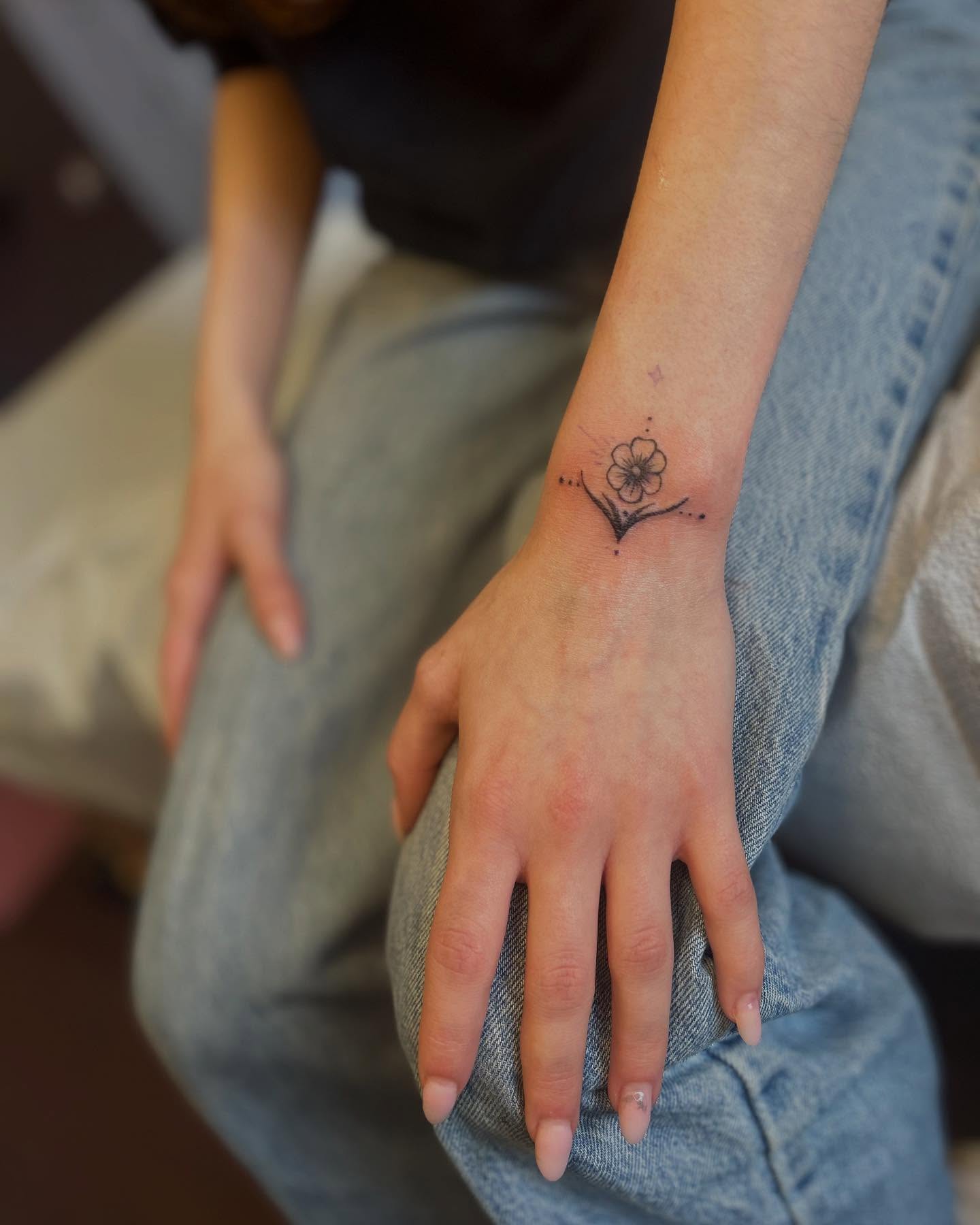 Blossoming Flower Wrist Tattoo