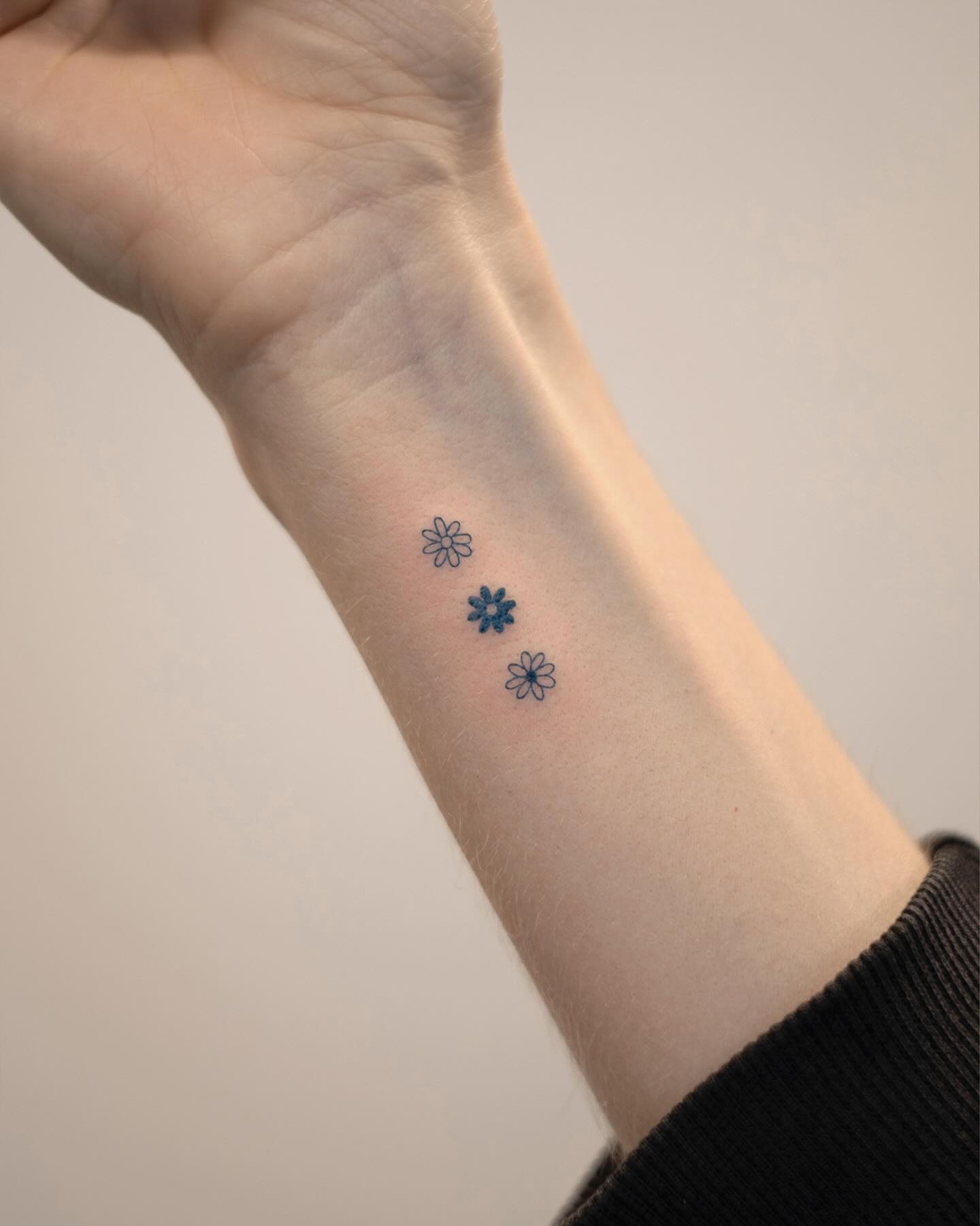 Tiny Flowers Wrist Tattoo