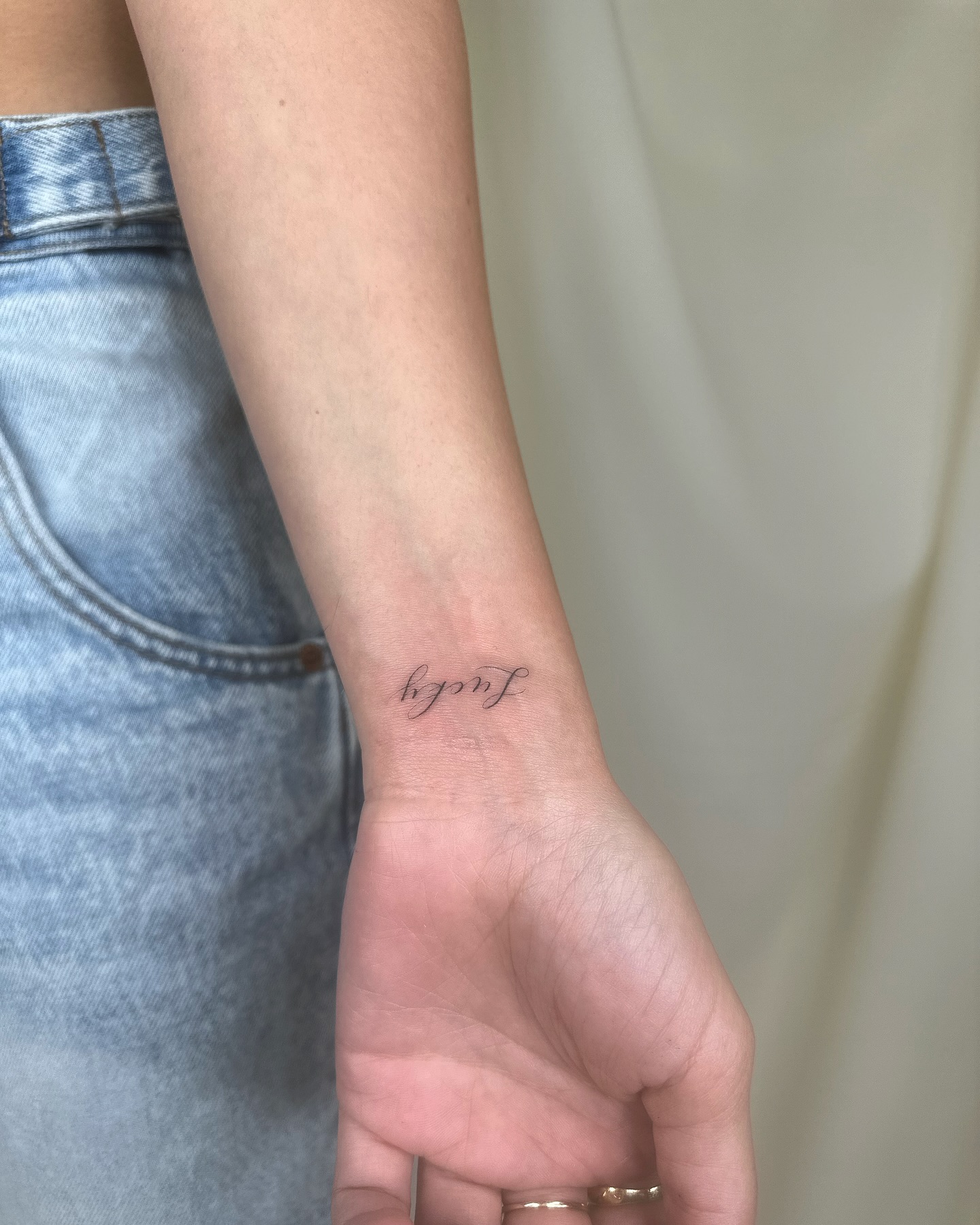Tiny Fine Line Wrist Tattoo