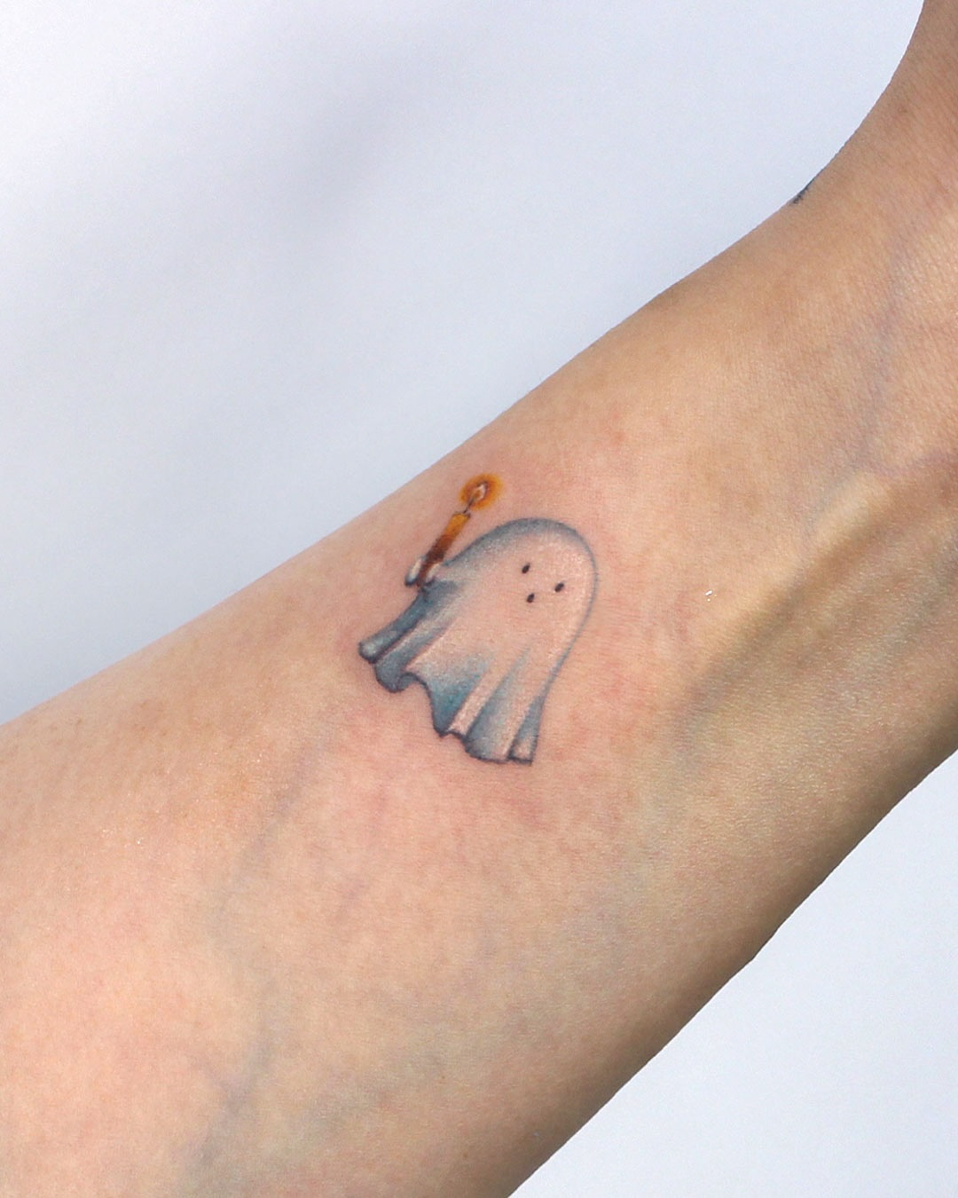 Spooky Ghost Wrist Tattoo