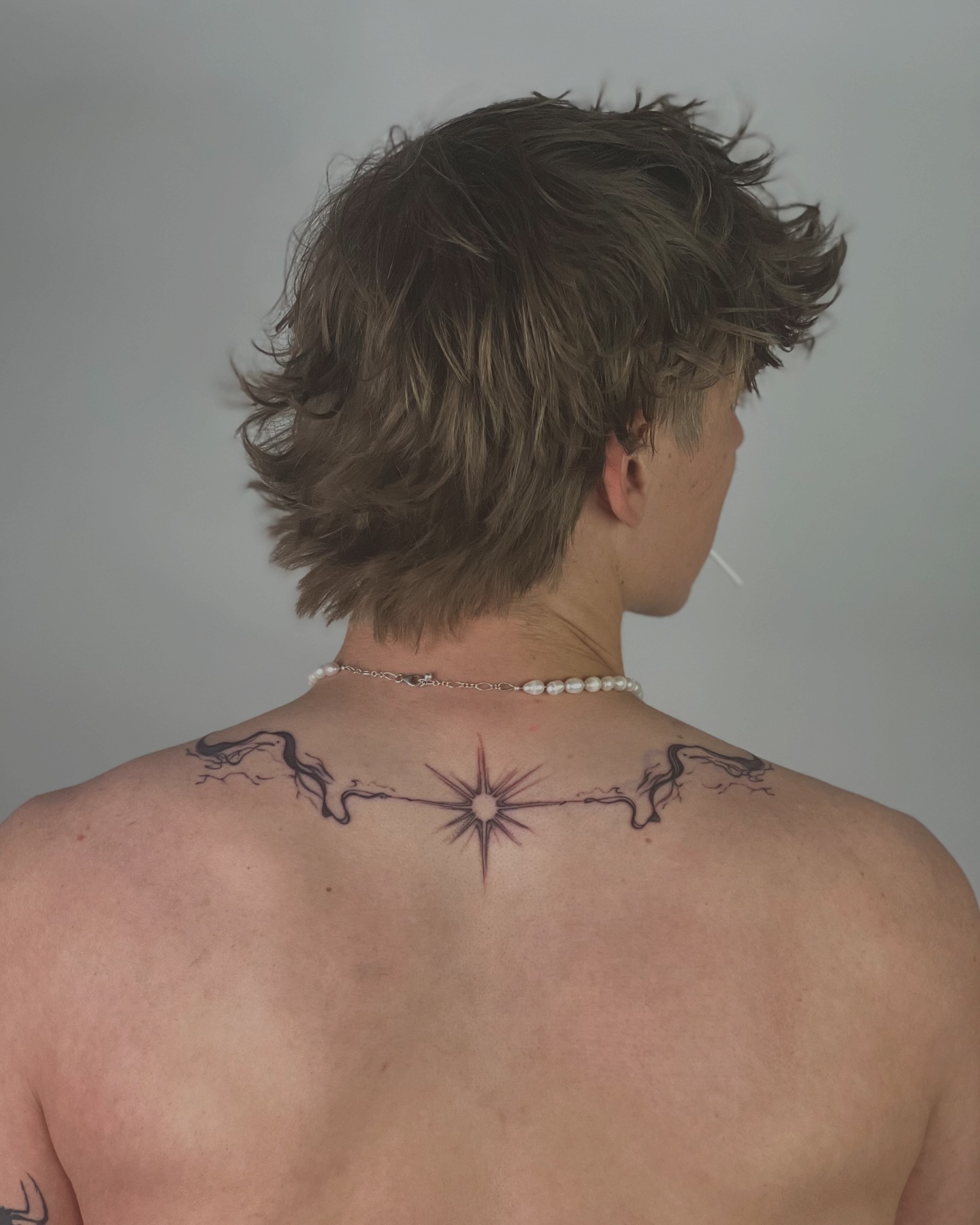 Upper Back Star Line Tattoo