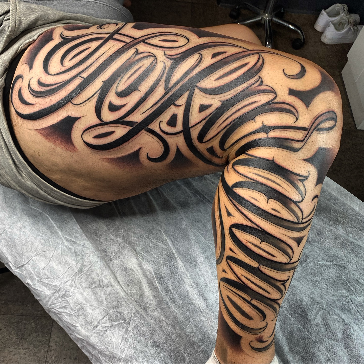 Freehand Lettering Thigh Tattoo