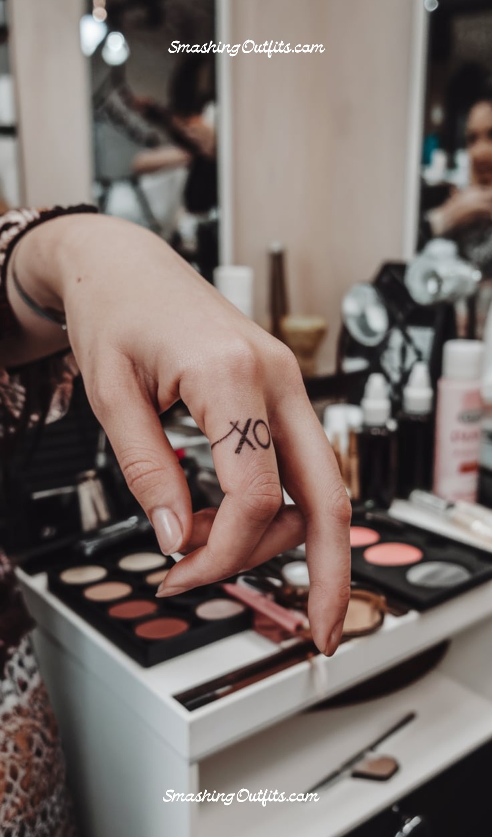 Small XO Finger Tattoo