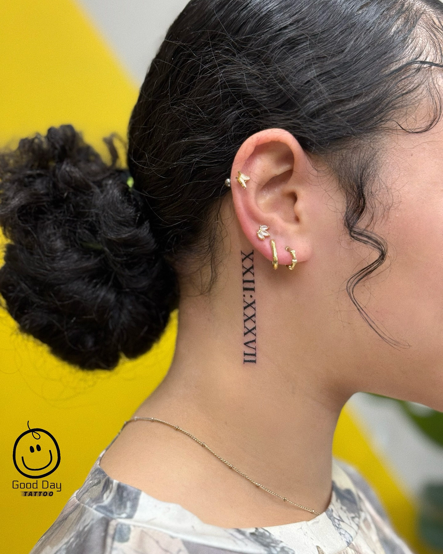 Roman numerals behind the ear