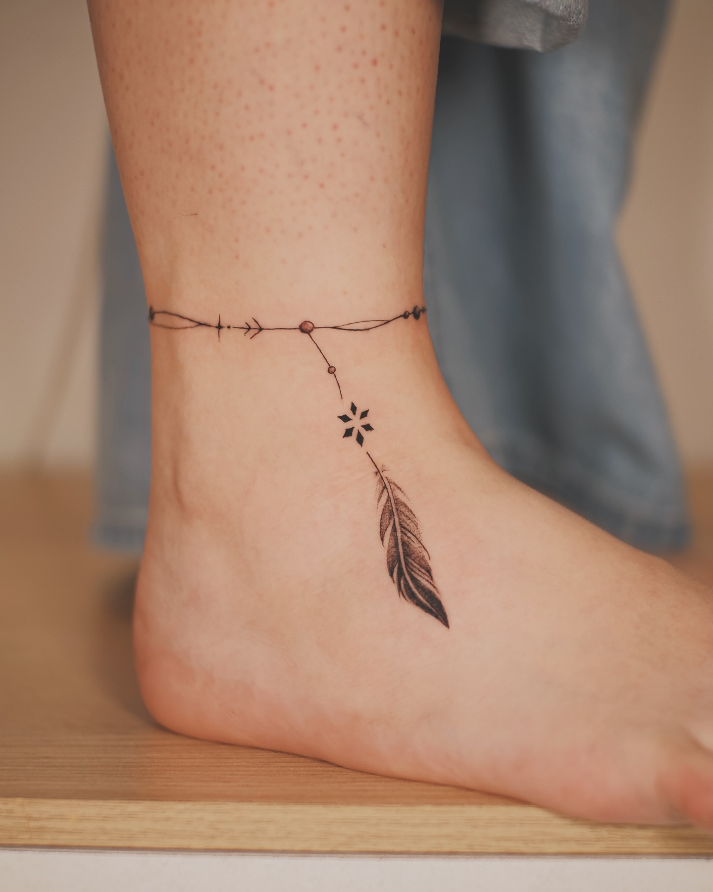 Leg Chain Feather Tattoo