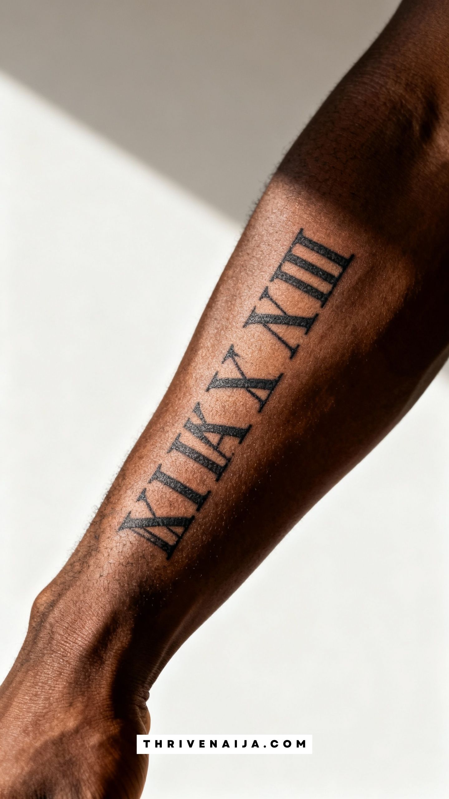 Matching Roman Numerals Forearm Tattoo