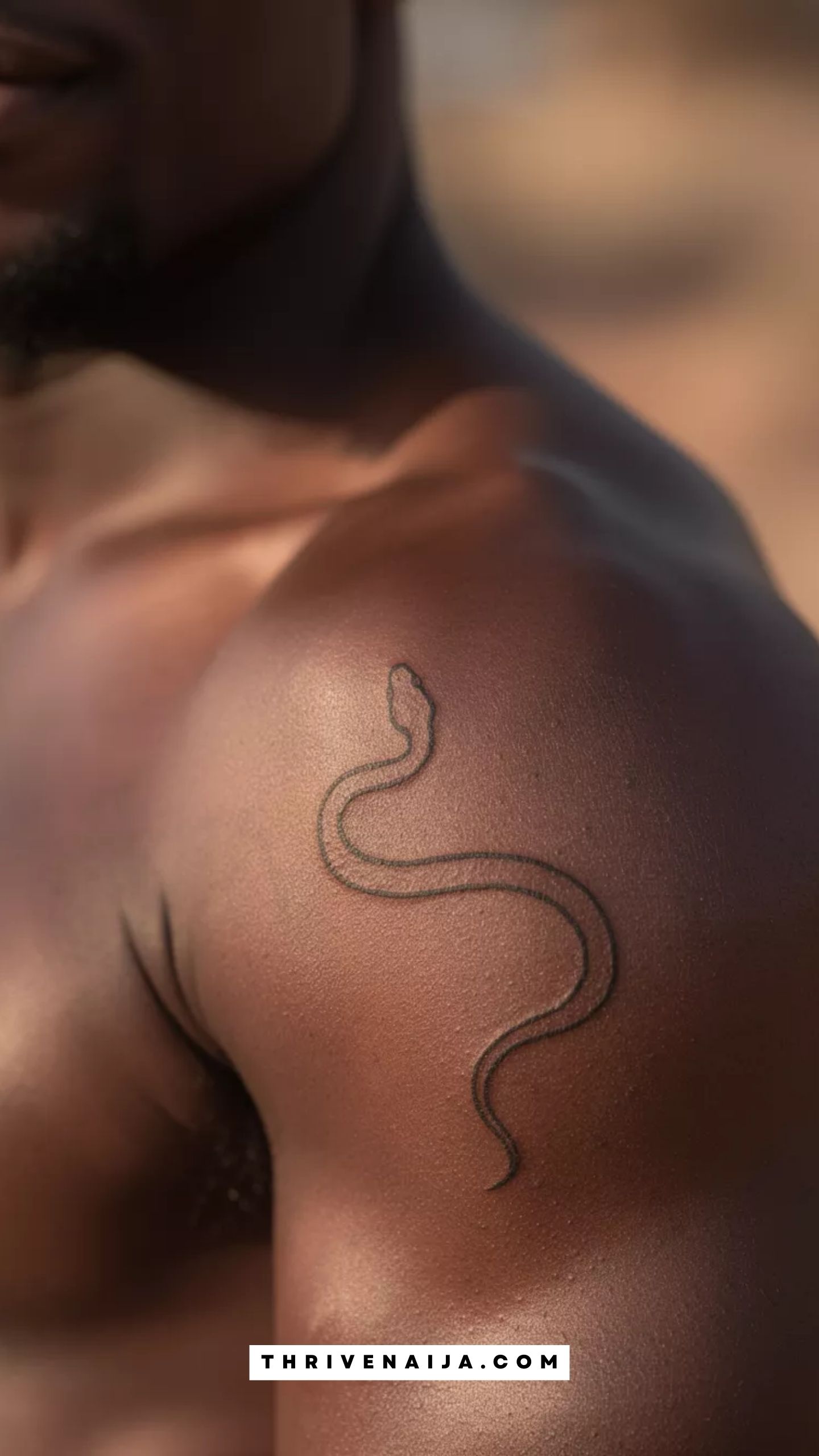Minimal Snake Curve Shoulder Tattoo