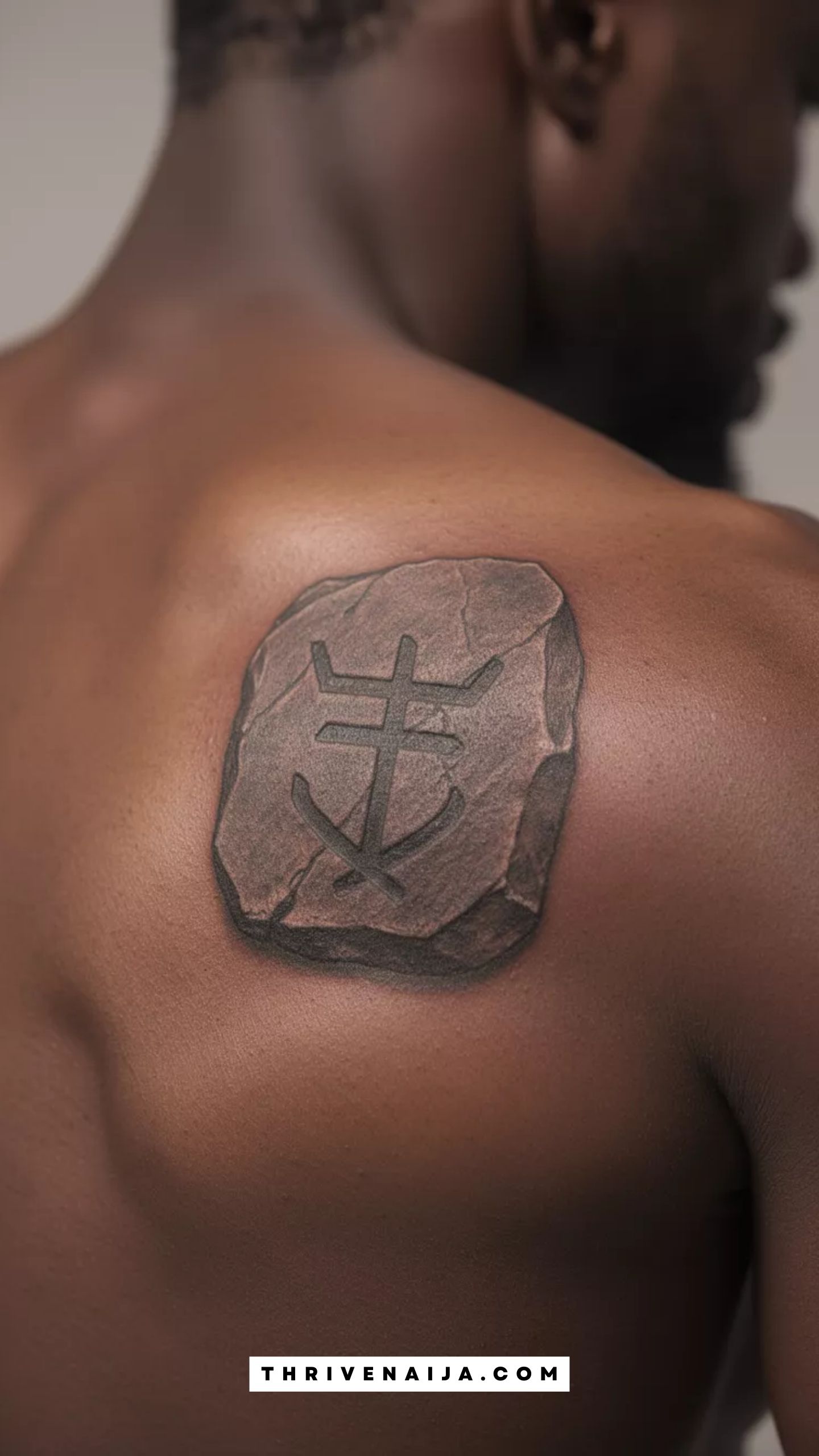 Stone Weight Symbol Shoulder Blade Tattoo