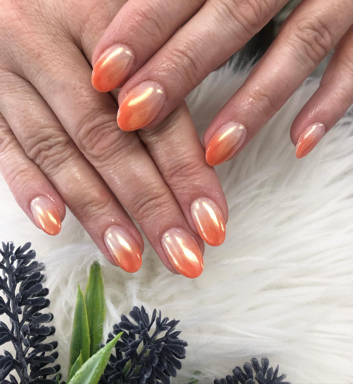 Orange chrome nails