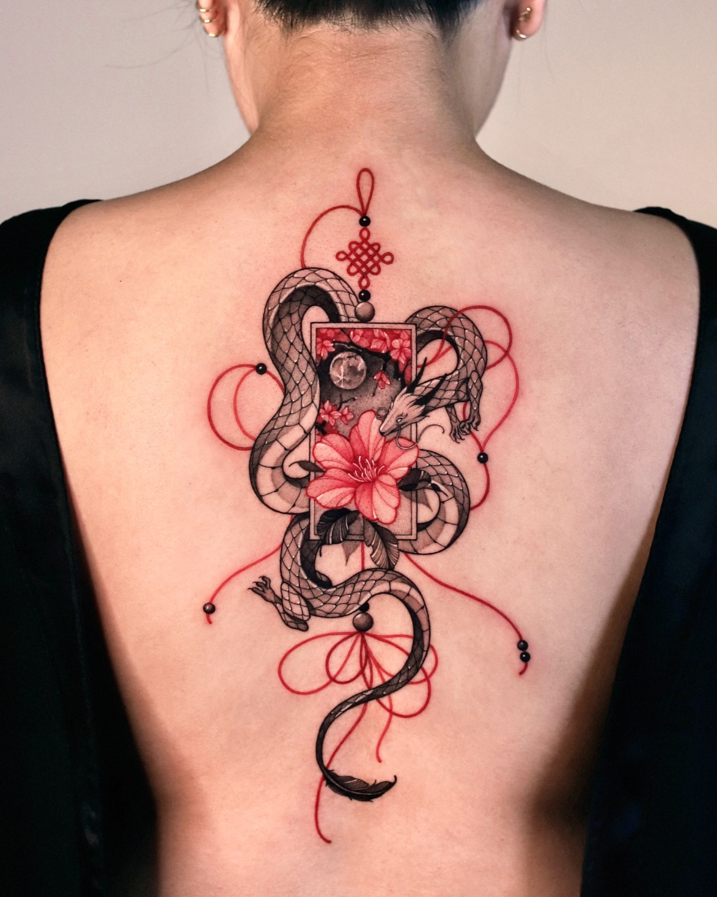 Red Custom Spine Tattoo