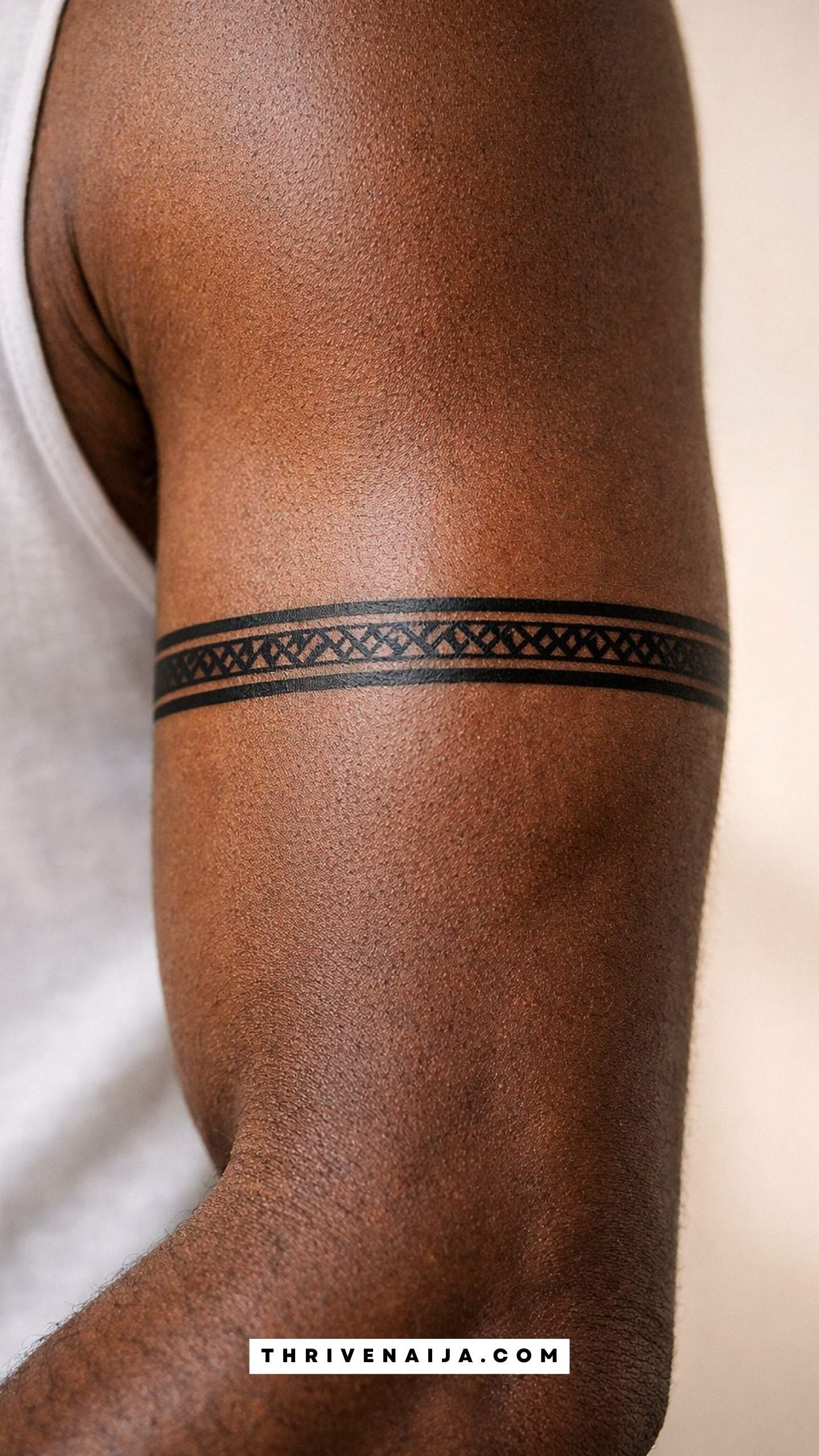 Thin Arm Band Above the Elbow Tattoo