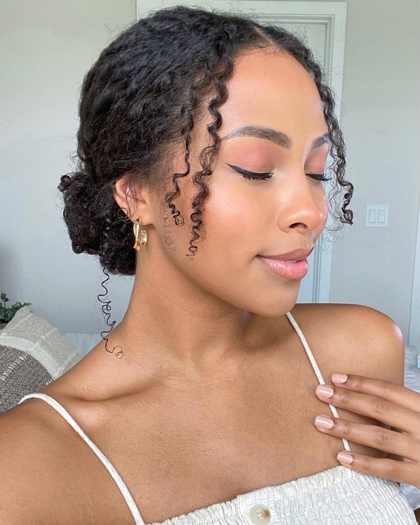 Flat Twist Low Bun with Curly Fringes