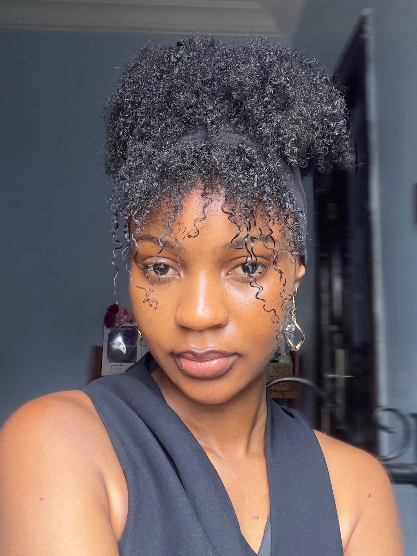 High Bun with Coily Bangs