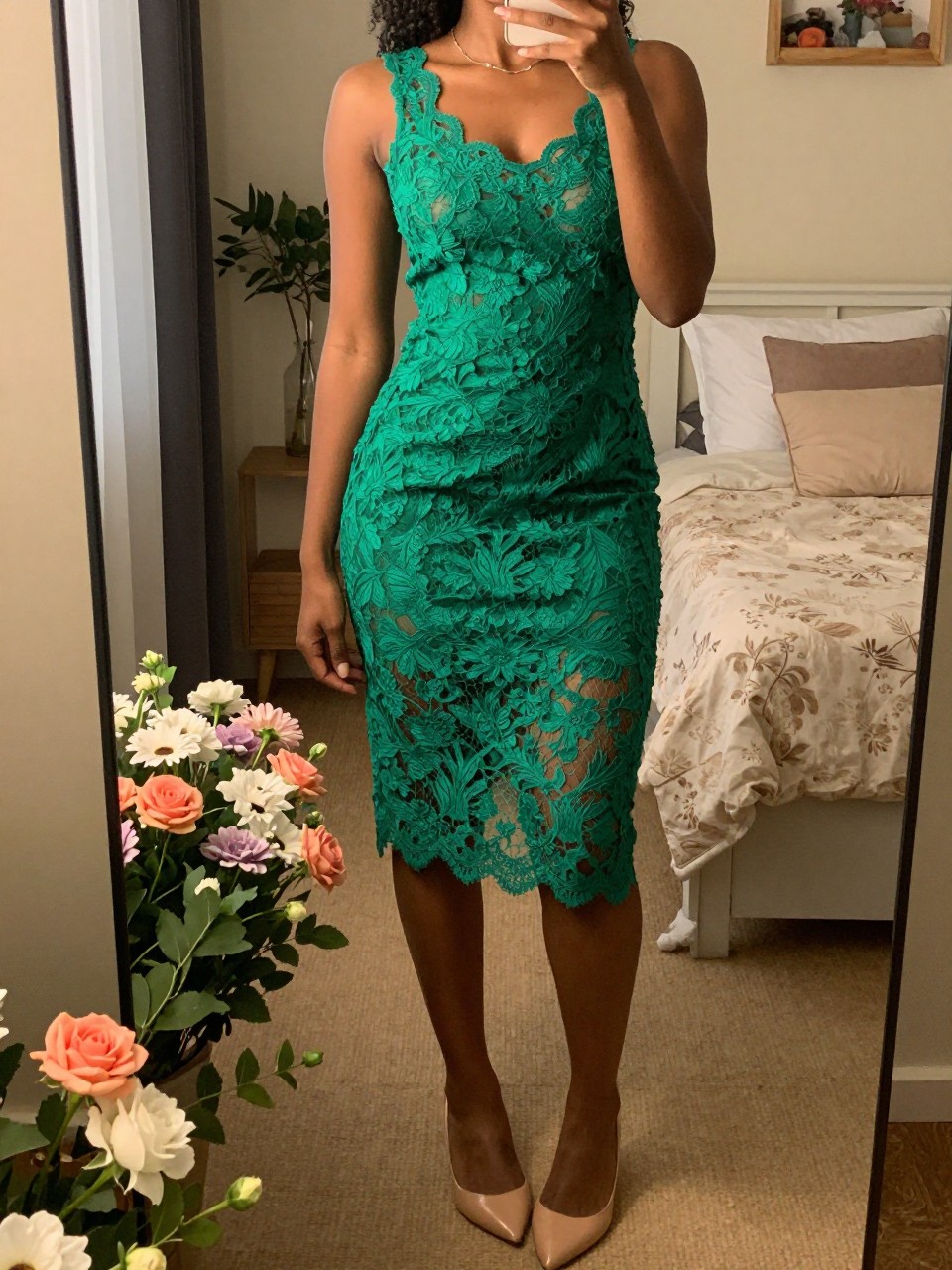 mirror selfie of a black woman in a green lace dress and nude flats, standing in a garden with flowers, cropped at NECK so face doesn't show, in a feminine-themed bedroom, warm moody lighting, iPhone photo quality.