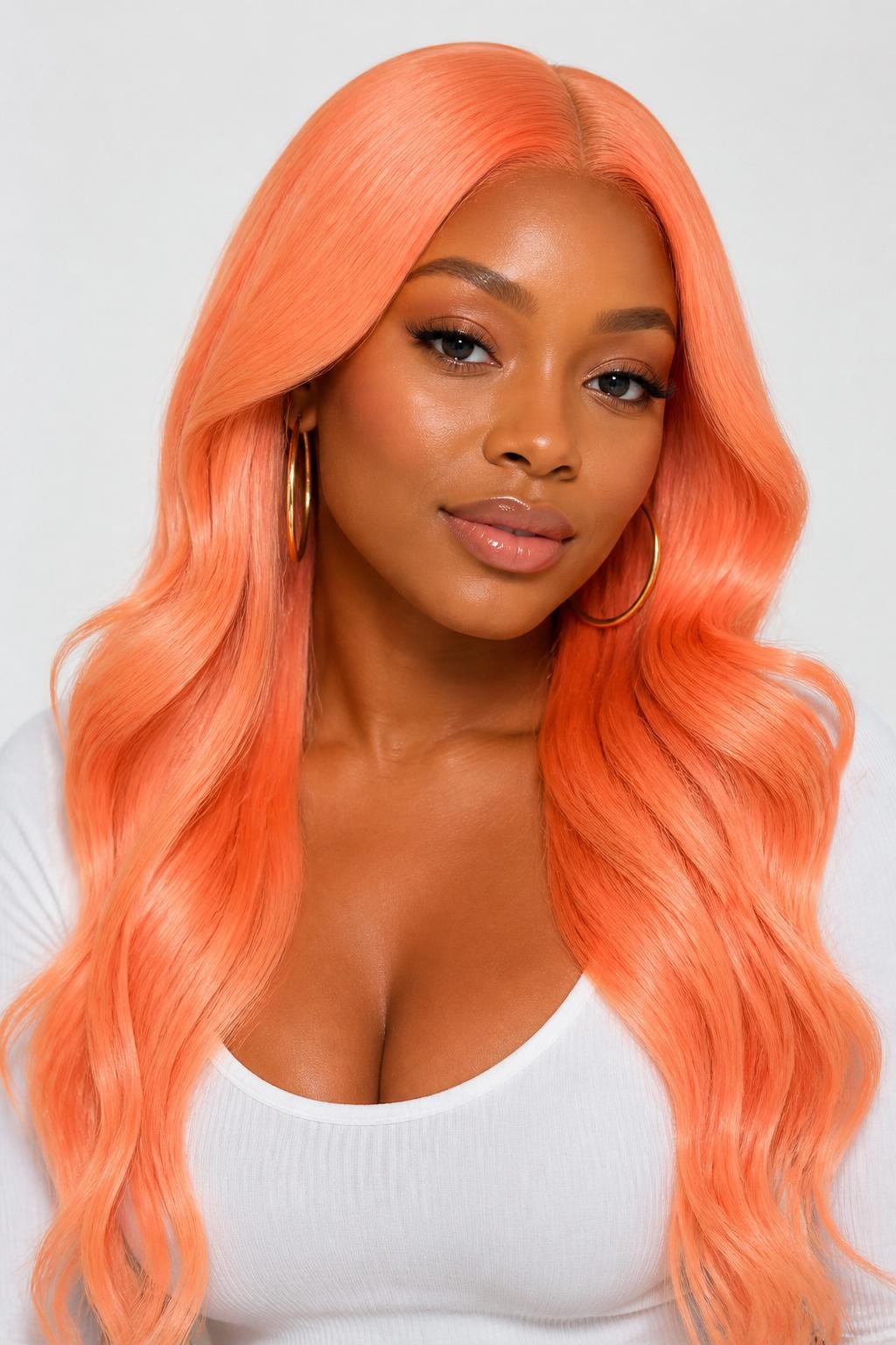 Image Prompt: A confident black woman with long bright peach hair, vivid peach-orange shade with glossy shine, center part, soft flowing waves, fresh glowing makeup, glossy lips, gold hoop earrings, fitted white top, clean bright studio background, soft flattering lighting, realistic DSLR beauty editorial portrait, detailed bright peach color and smooth wave texture, no text, (no watermarks on images)