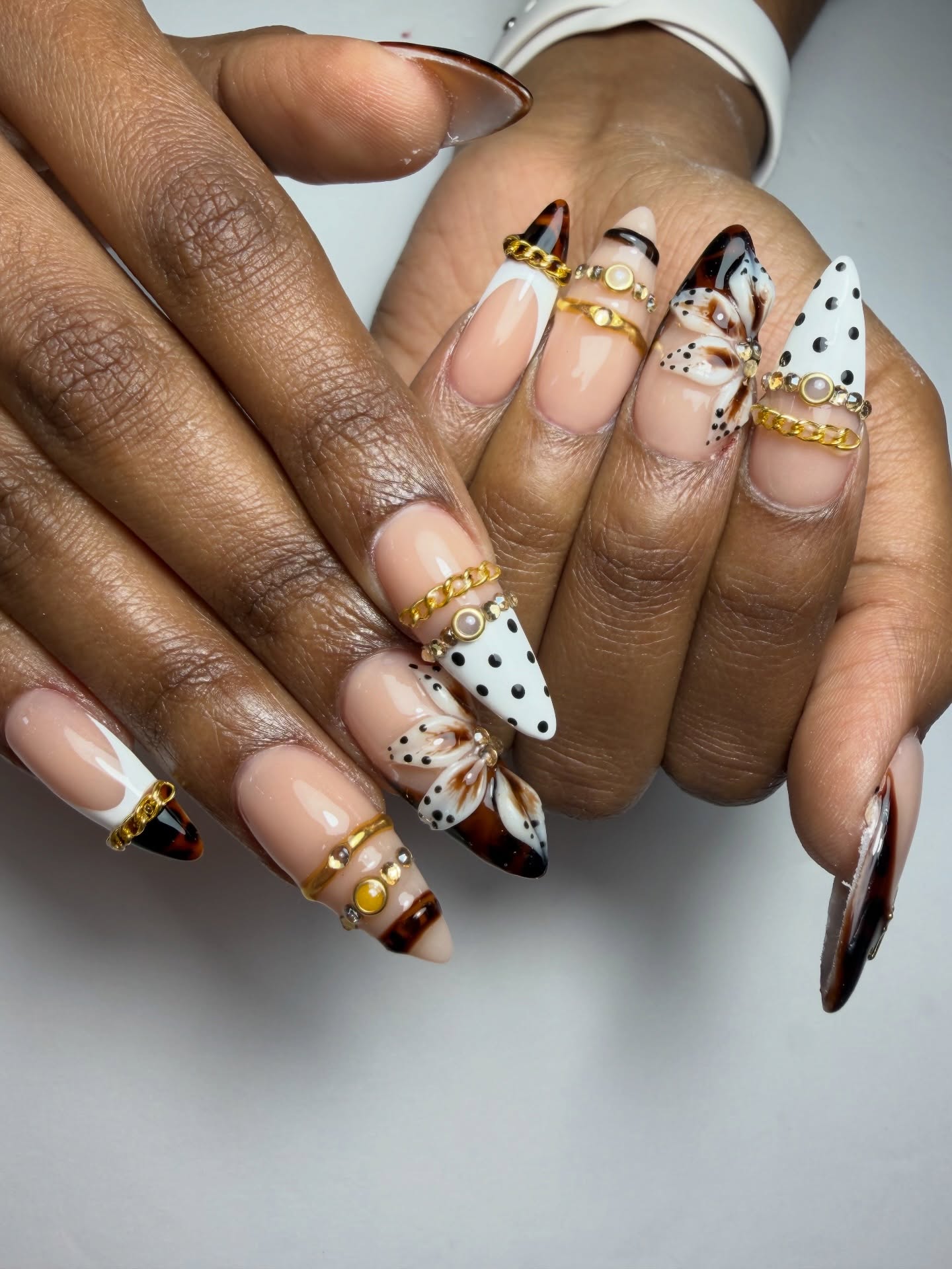 Floral Artwork Nails with Delicate Gems and Gold Details
