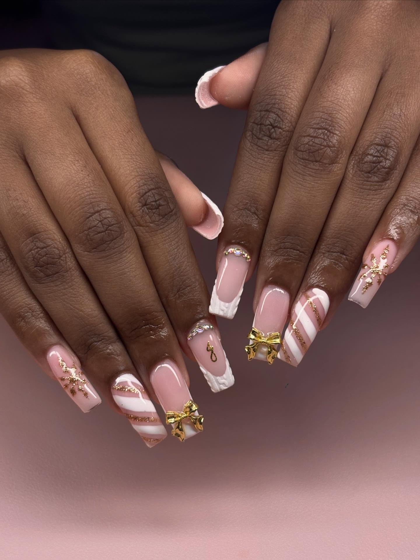 Soft Christmas Nails with Gold Bow